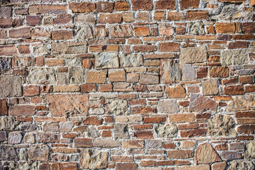 Stone wall of rough unprocessed stones.