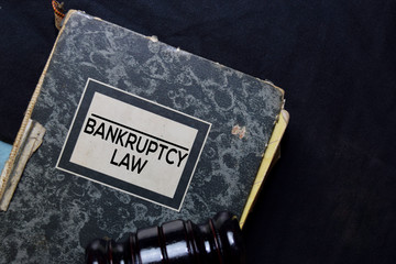 Bankruptcy Law book and gavel isolated on office desk. Law concept