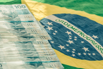Brazilian money, 100 reais banknote with the National flag