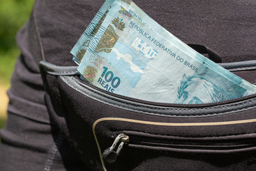 sachet full of Brazilian 100 reais