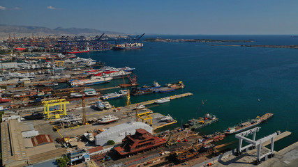 Aerial photo of industrial old shipyard repairing small boats in Mediterranean port