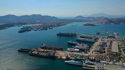 Fototapeta na wymiar Aerial photo of industrial shipyard of Perama repairing small boats near Salamina island, Attica, Greece