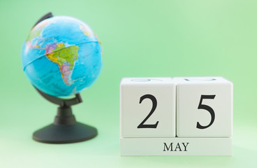 Planner wooden cube with numbers, 25 day of the month of May, spring