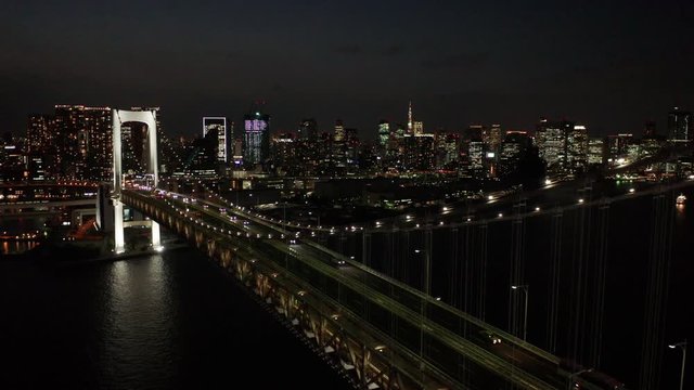 alt flying backward alongside Rainbow Bridge in Tokyo