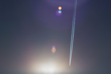 aricraft contrail and  lens flair