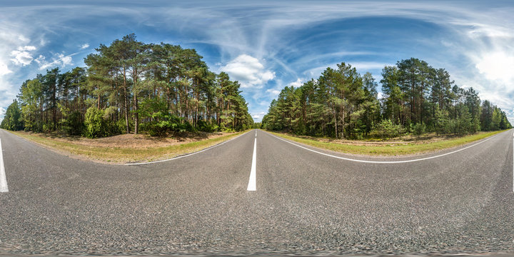 full seamless spherical hdri panorama 360 degrees angle view on asphalt road among pinery forest in summer day with awesome clouds in equirectangular projection, ready  VR AR virtual reality content