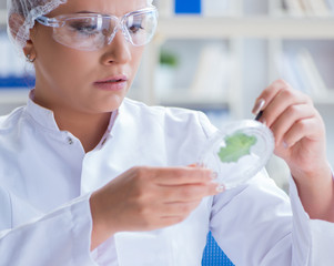 Female scientist researcher conducting an experiment in a labora
