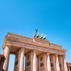 Brandenburg Gate (Brandenburger Tor) in Berlin, Germany, on a bright day with blue sky © tilialucida