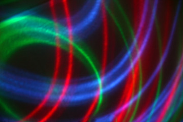 abstract background, neon lines of glowing stripes, bright on a dark purple-red background