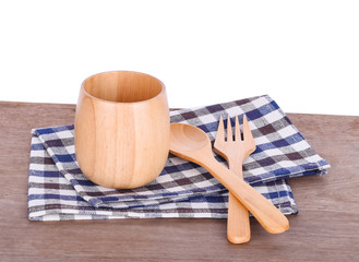 Cup and spoon wooden on white background