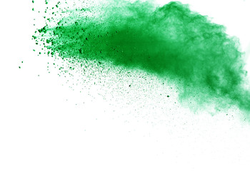 Green powder explosion on white background.