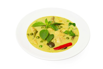 Closeup plate of thraditional thailand meal - green curry with chicken and eggplants served in a plate isolated at white background.
