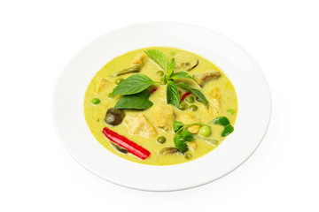 Closeup plate of thraditional thailand meal - green curry with chicken and eggplants served in a plate isolated at white background.