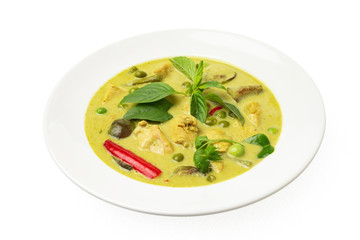 Closeup plate of thraditional thailand meal - green curry with chicken and eggplants served in a plate isolated at white background.