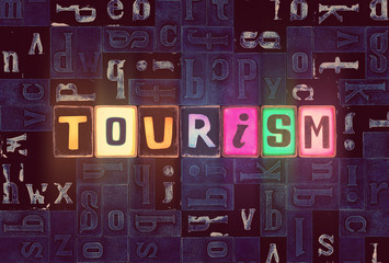 The word Tourism as neon glowing unique typeset symbols, luminous letters tourism