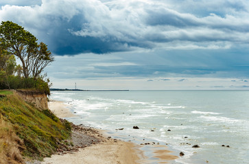 Rocky coast line of the Baltic sea in Latvia, during sunny summer day with blue sky.