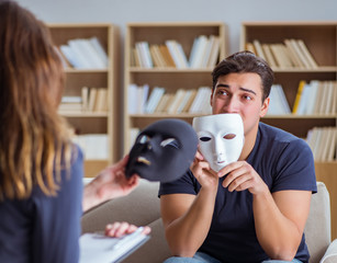 Man attending psychology therapy session with doctor