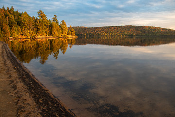 Rich colors at dusk on the water in Algonquin Park in autumn