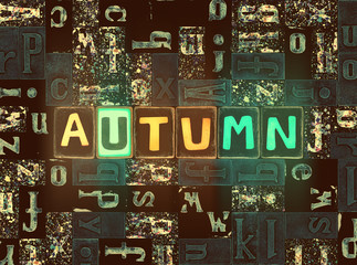 The word Autumn with neon luminous glowing, unique typeset letters abstract mosaic pattern background, lettering symbols collection for autumn poster