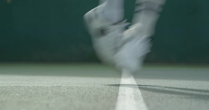 Close up of a Tennis Player serving.