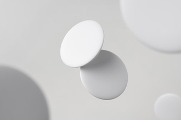 top view of white badge on white background