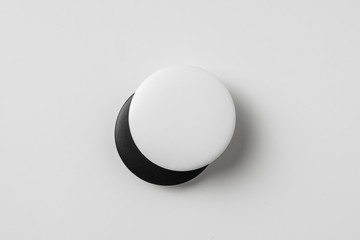 top view of black & white badge on background