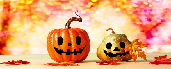 Halloween pumpkins with shiny orange and pink background