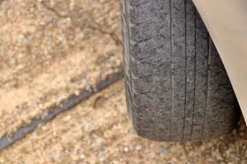 Worn out tyre concept. Danger of using a worn out tyre with very little tread remaining.