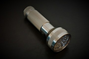 flashlight on black background, isolated, flashlight, light, metal, lamp, object, torch, equipment, bullet, flash, led, black, ammunition, lantern, tool, electric, shiny, sound, power, weapon, cable