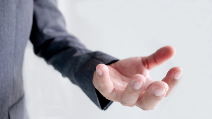 The sleeve of a business man wearing a suit  and hand on white background,  Concept hand style.