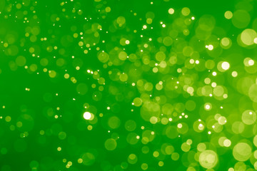 Abstract Green bokeh defocus glitter blur Background.