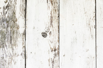 Background of white wooden grunge planks. Peeling paint on an old wooden table, white background of old surface