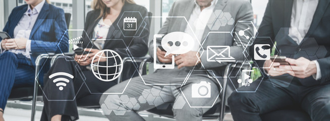 Multimedia and Computer Applications Concept. Business people using technology of digital gadget with modern graphic interface showing social, shopping, camera and multimedia application on device.