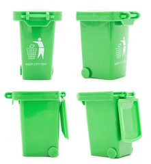 Set of green plastic toy trash cans isolated on white background