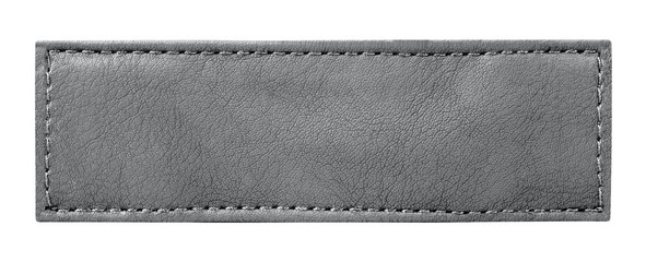 close up of a jeans label leather isolated onwhite with clipping path