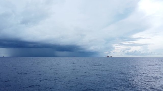 Central processing platform (cpp) in the middle of the ocean on cloudy day - upstream industry