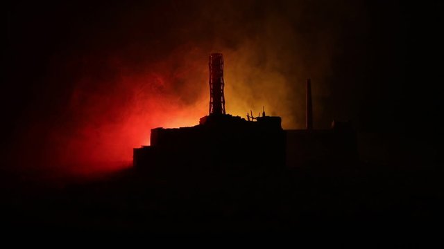 Creative artwork decoration. Chernobyl nuclear power plant at night. Layout of abandoned Chernobyl station after nuclear reactor explosion. Selective focus