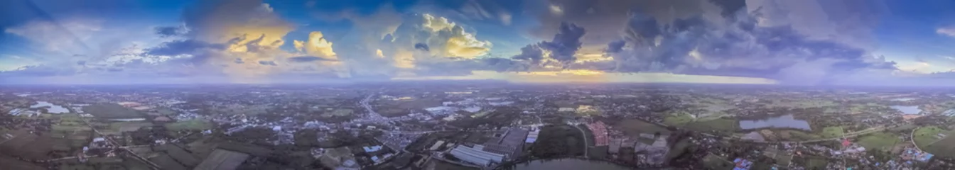 Foto op Canvas Aerial view panorama 360 degree above green rice fields, village, and reservoir with cloudy sky background, Krajub reservoir in Ban Pong, Ratchaburi, Thailand. © Yuttana Joe