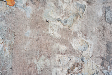 Texture of a concrete wall with cracks and scratches which can be used as a background
