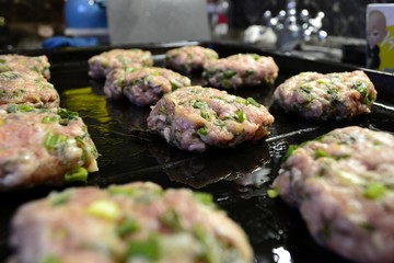 Raw cutlets on a baking sheet (semi-finished)