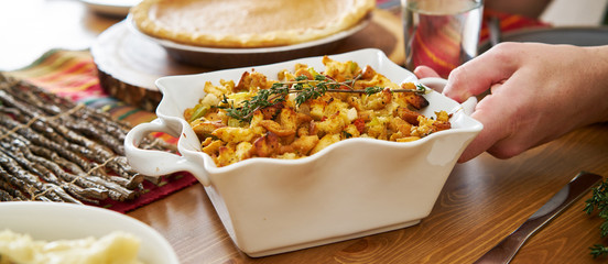 baked stuffing in casserole dish at thanksgiving dinner