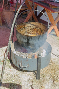 black kettle for campfire on tripod