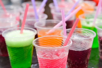 Colorful soft drink in plastic cup