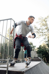 Roller skating, young skater rolling off the ramp