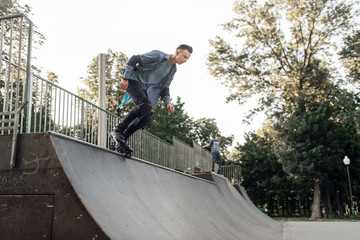 Roller skating, young skater rolling off the ramp