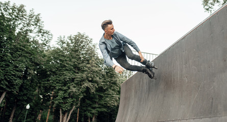 Roller skating, young skater rolling off the ramp