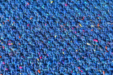 Obraz premium Knitted fabrics. Background of a knitted fabrics. .Blue cloth with diagonal stripes knitted by hand.