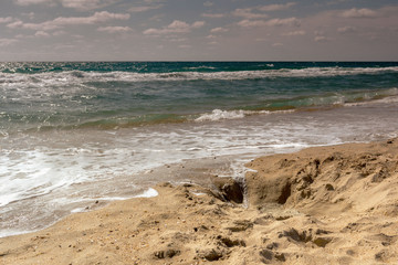 sea wave running on the sandy shore