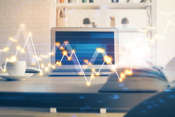 Forex market graph hologram and personal computer on background. Double exposure. Concept of investment.