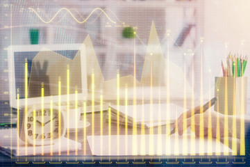Financial graph displayed on woman's hand taking notes background. Concept of research. Multi...